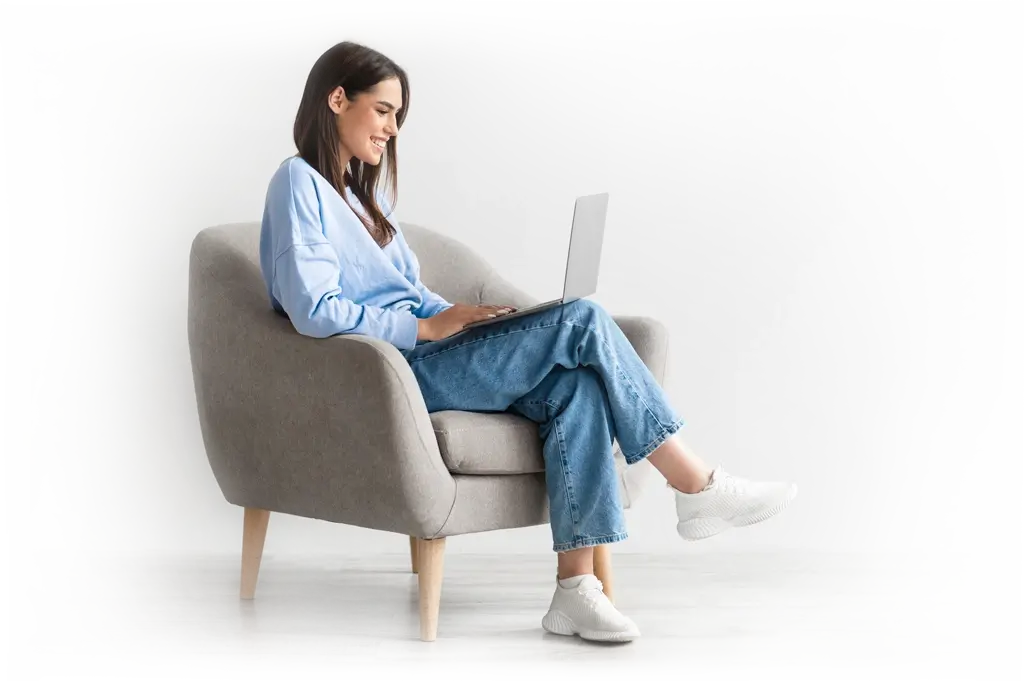 Girl on sofa checking bank account